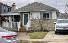 Color photo of front, exterior of house