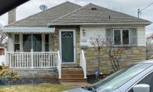 Color photo of front, exterior of house