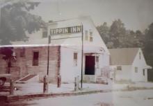 Tippin Inn facing Cushman Ave at the corner of Cedar Ave